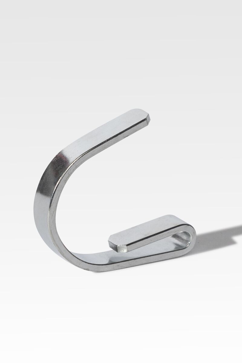 A silver metal clip shaped like the letter "C" is displayed upright against a plain, light gray background.